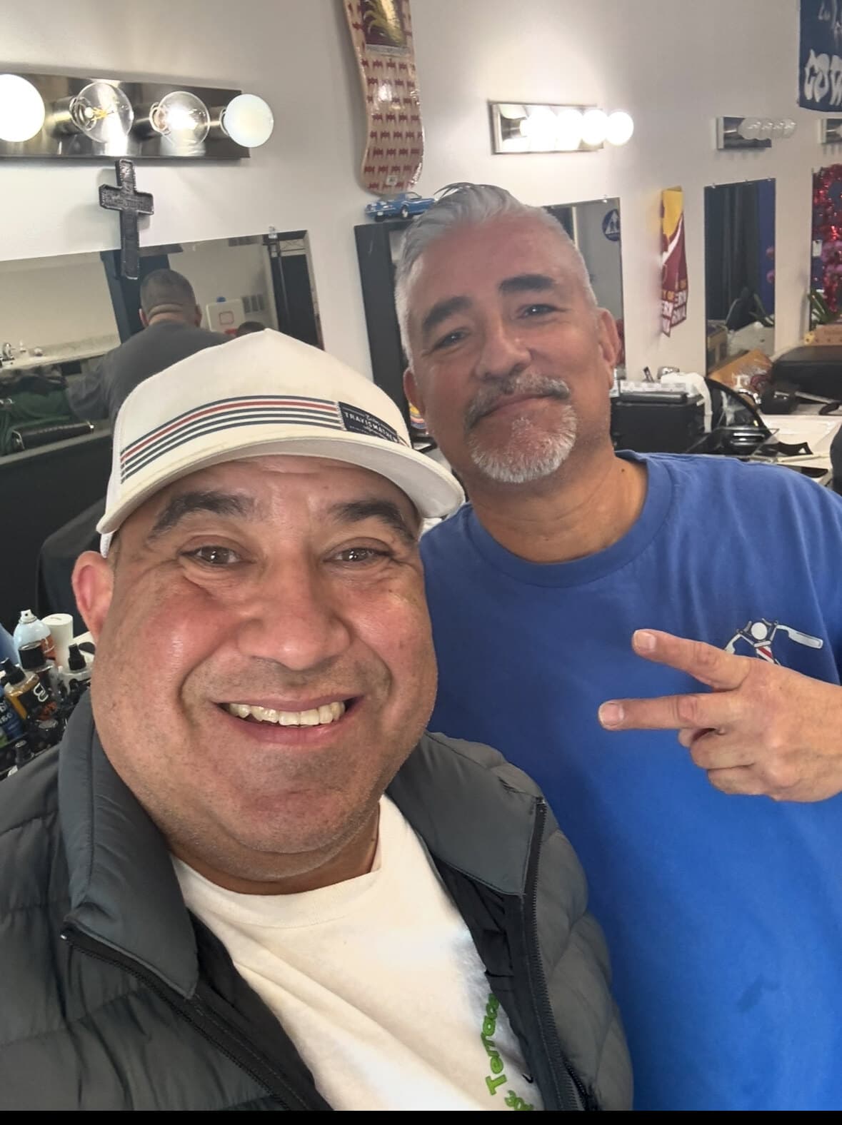Joe’ll with a local barber